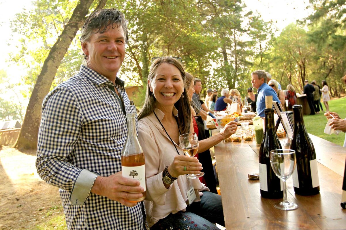 Diners pour wine at Pure Mendocino
