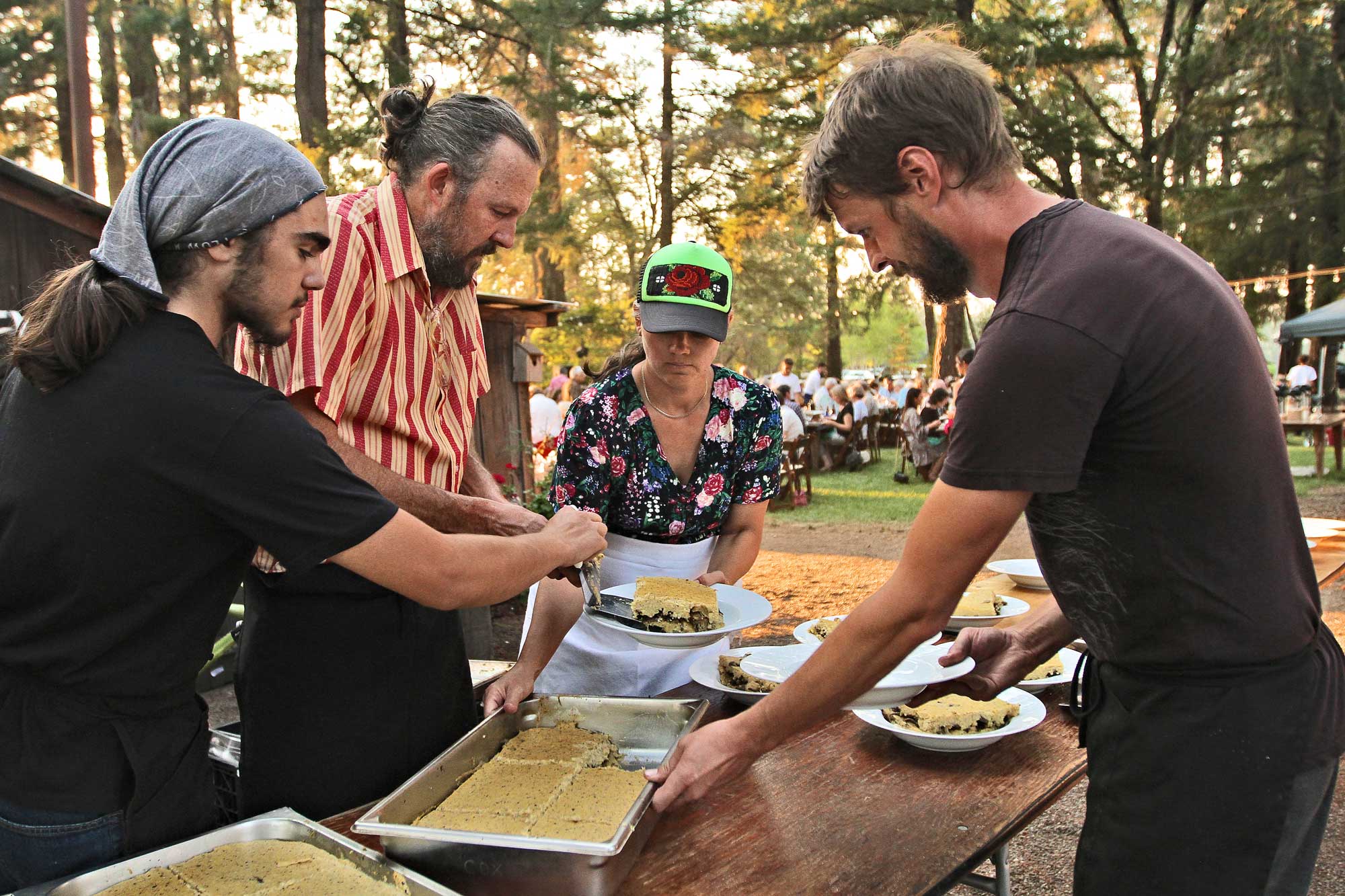 Chef Olan Cox prepares dishes outdoors at Pure Mendocino
