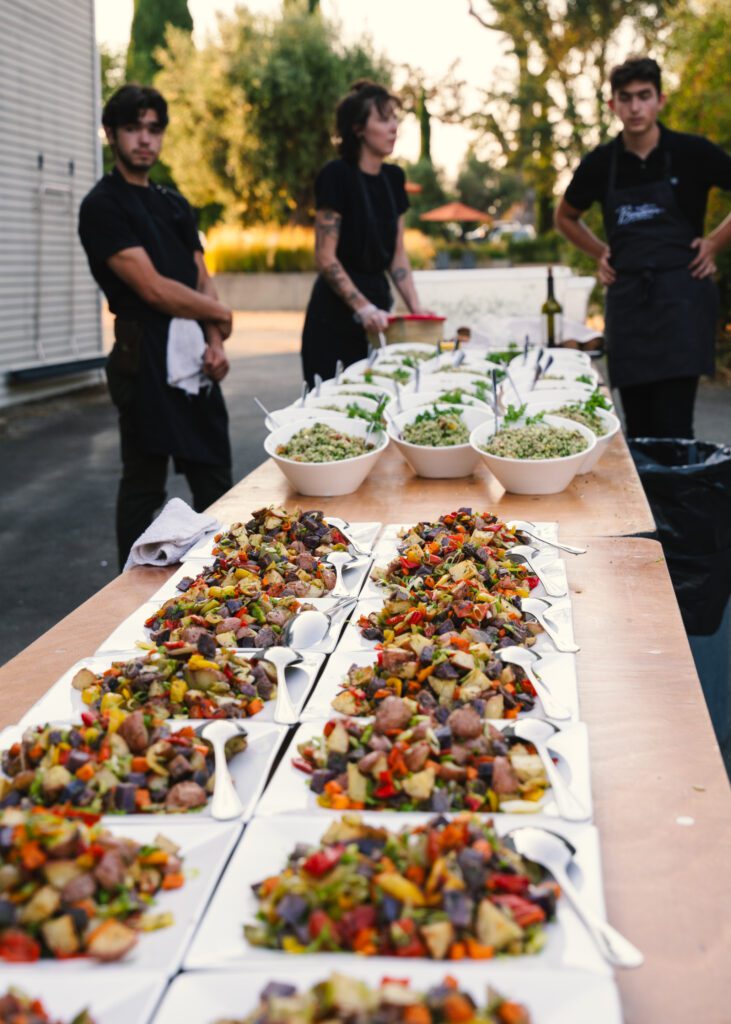 Chef Olan Cox finishes plates at Pure Mendocino.