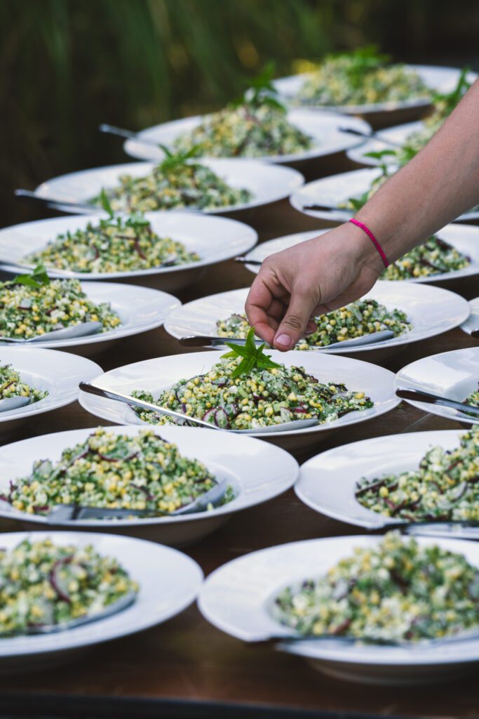 Chef Olan Cox finishes plates at Pure Mendocino.