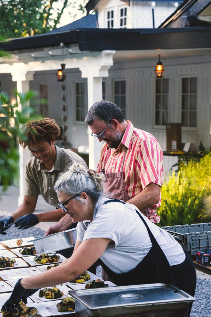 The buffet at the organic dinner offers wedges of Pink Pearl apples from the Apple Farm, covered with Shamrock Farms goat cheese.